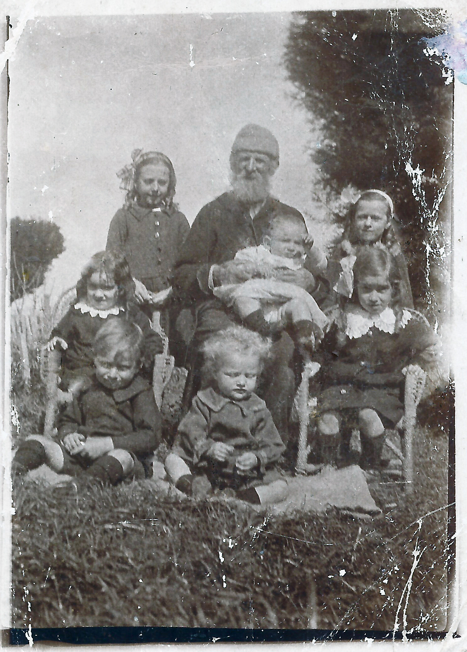 Edith, Jack holding Benjamin George, Jean, Olive, Evelyn, Harry Evans and is it Eva after Aug 1917 Mervyn Lawn